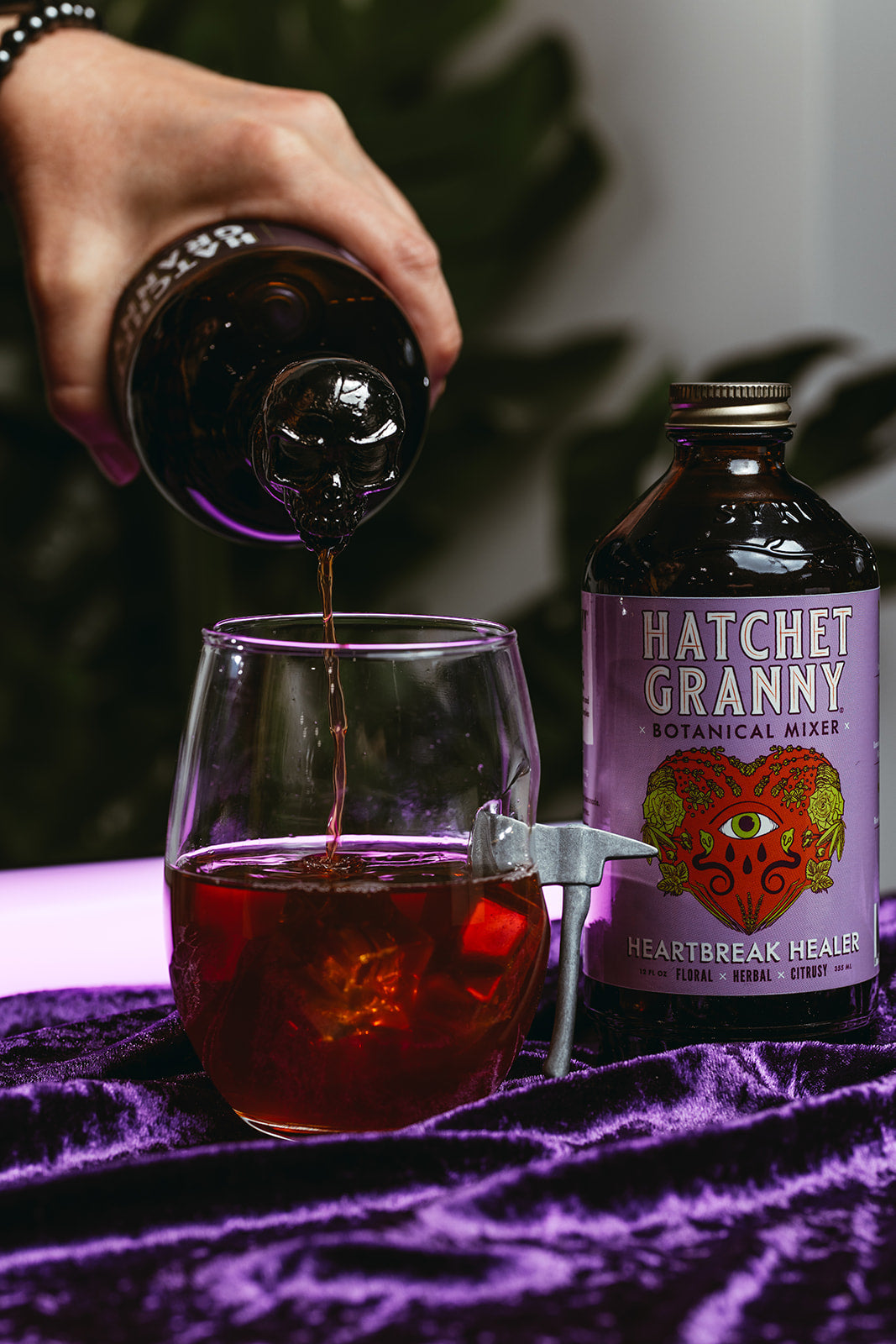 Heartbreak Healer being poured into a glass over ice